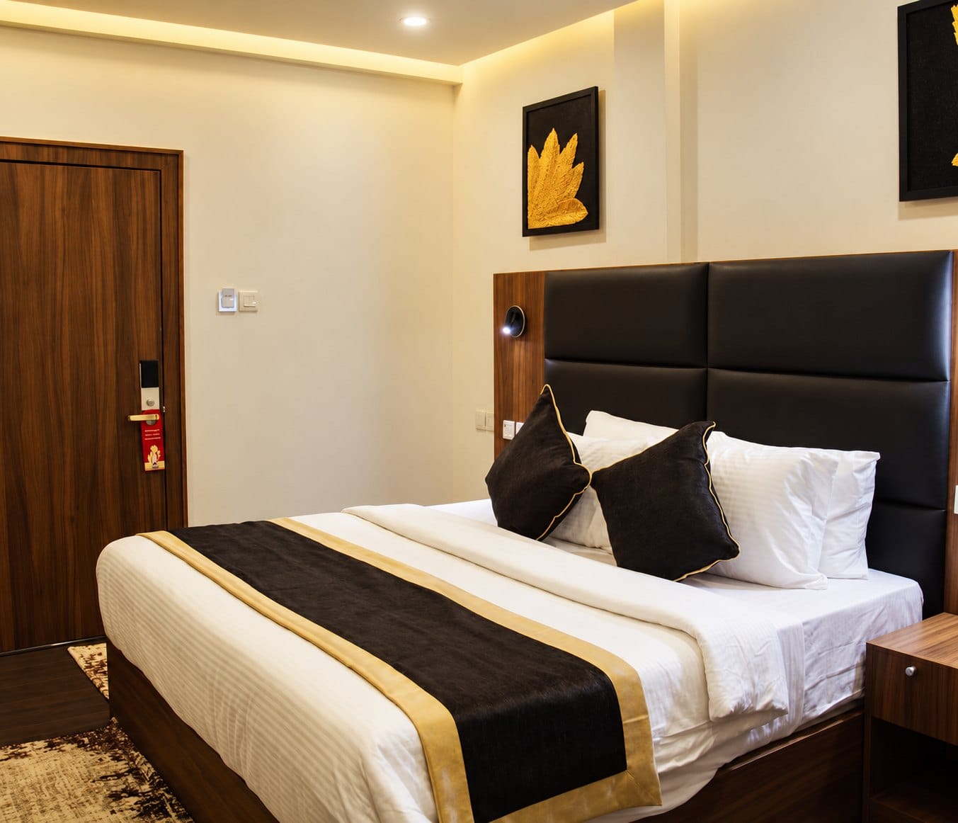 Oriental Oasis: leather headboard and a gold-and-black bed runner
