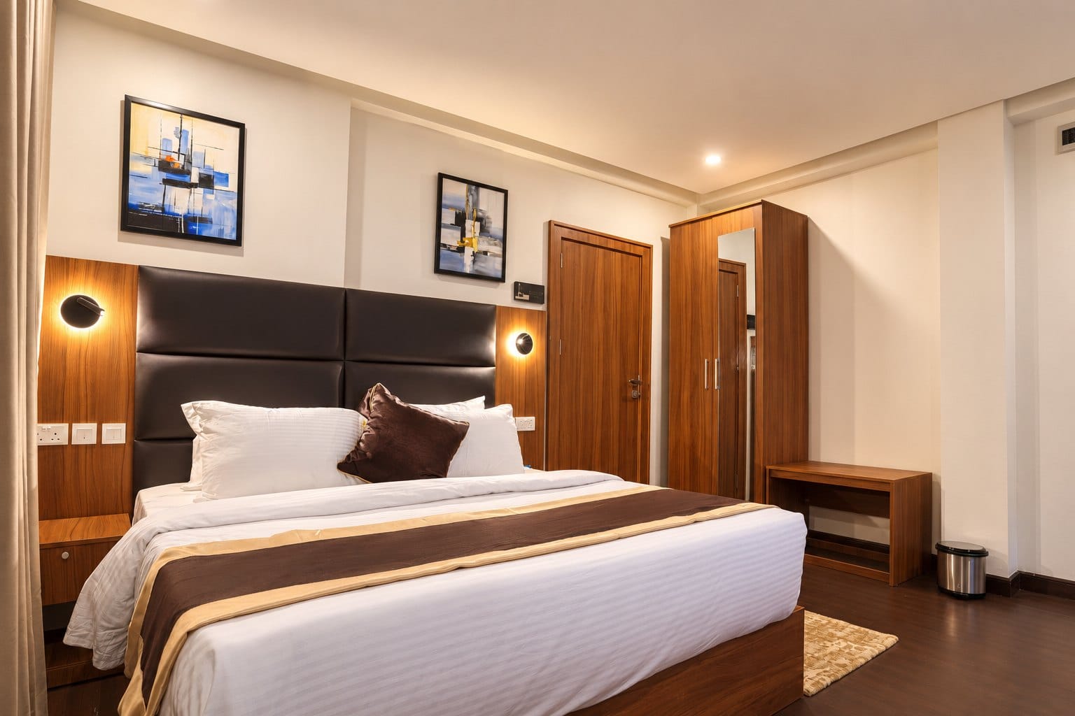 Oriental Oasis: bed with framed art and a built-in wardrobe
