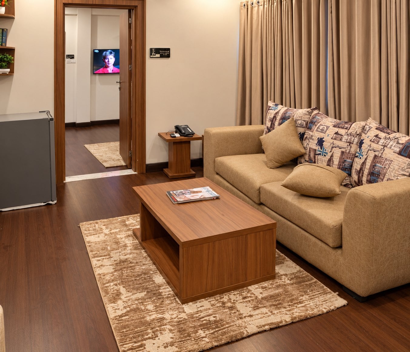 Renaissance Suite: separate lounge with a caramel sofa